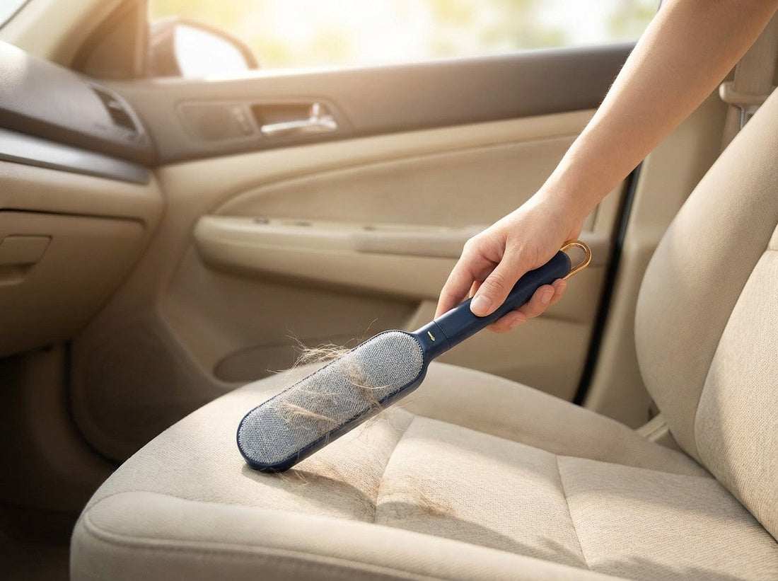 Person using lint brush to remove pet hair from car seat
